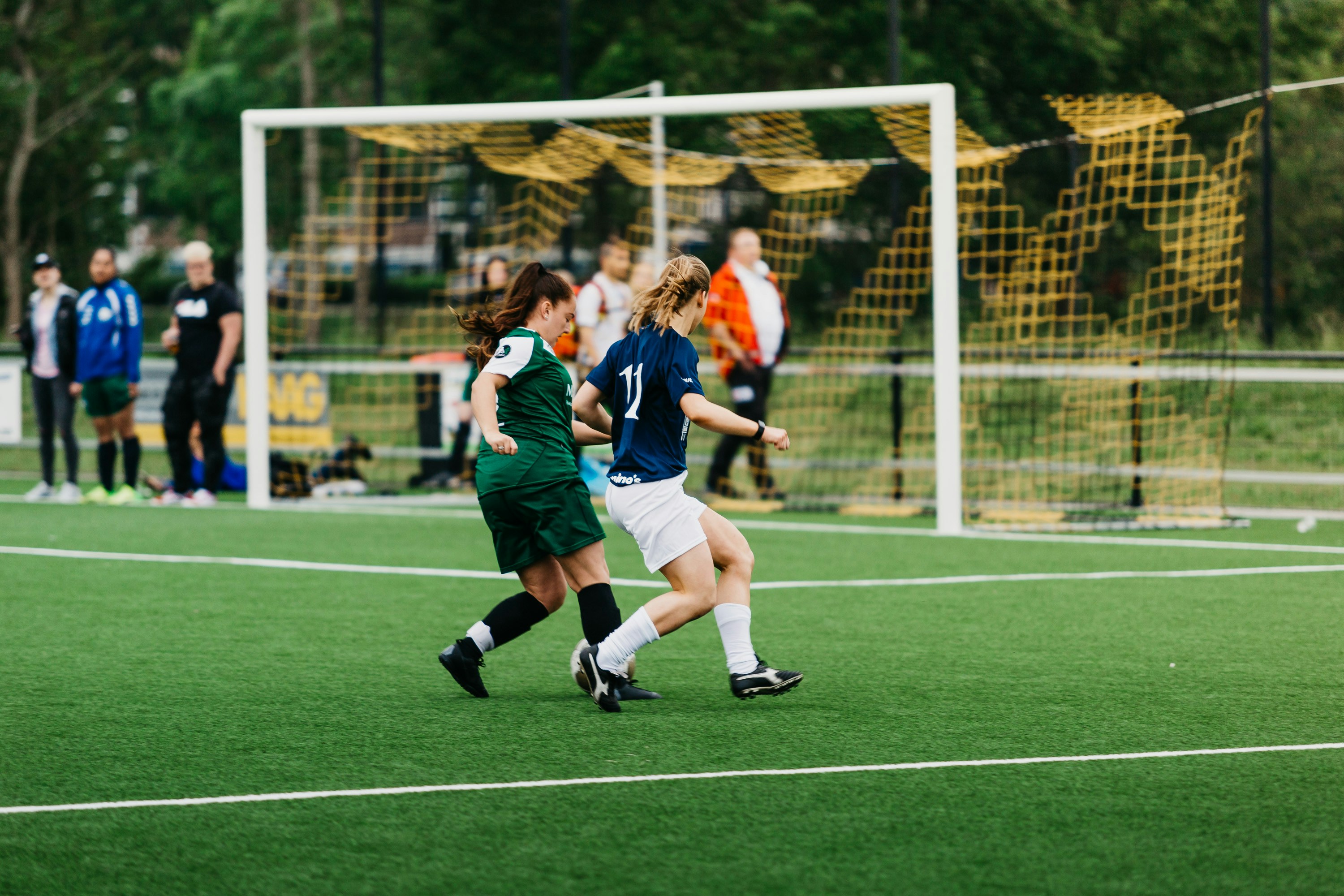 two girls playing soccer