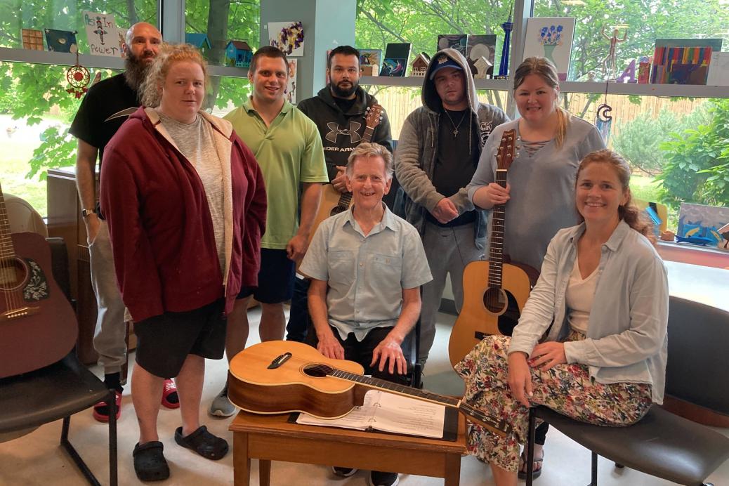 Ottawa musician Michael Fahey (centre) and recreation therapist Ashleigh McGuinty (seated at right) with some members of The Royal’s guitar group.