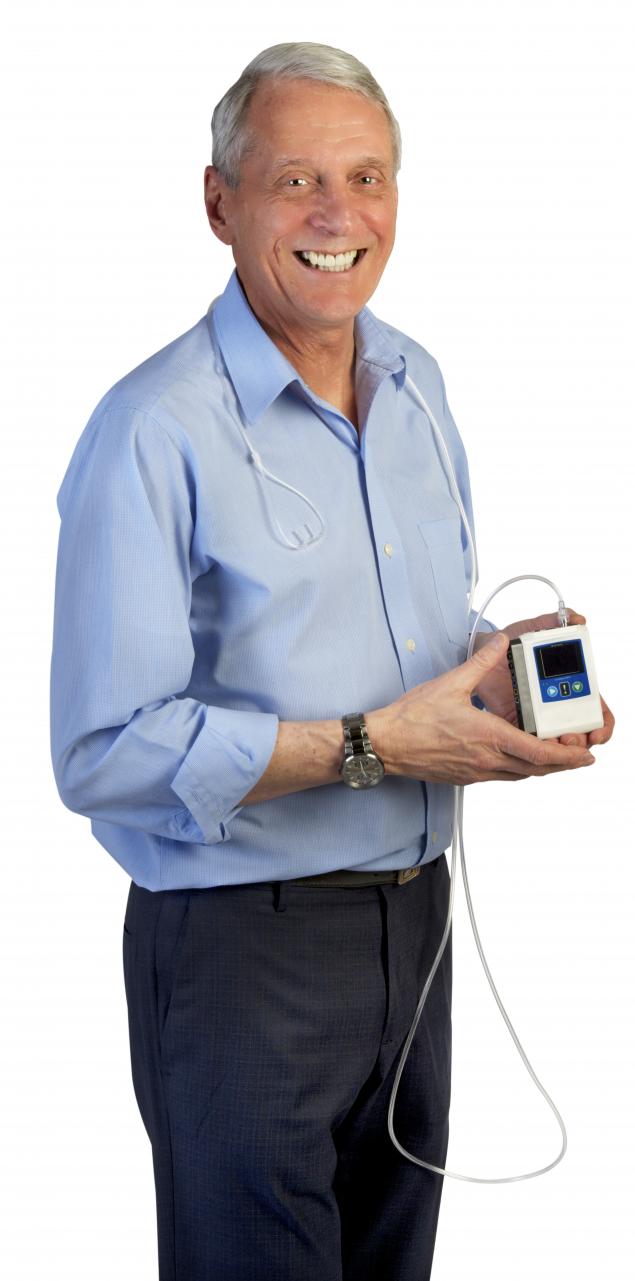 Photo of Barry Simms holding a portable sleep device Photo of Barry Simms holding a portable sleep device
