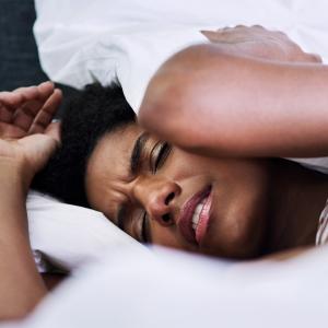Woman having a restless sleep