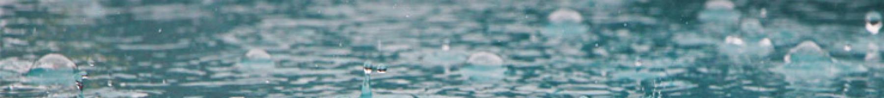 Rain drops falling on water Rain drops falling on water